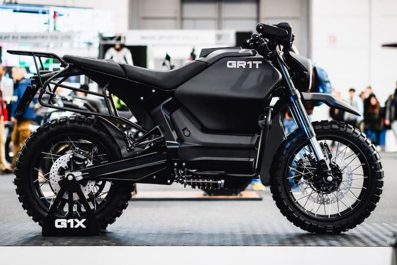 Side view of the GR1T G1X Raider all-electric tactical motorcycle on display in Verona
